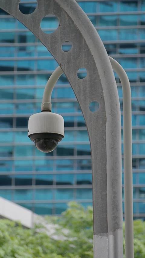 Camera on a pole near a building in a city area Stock Footage 342690464