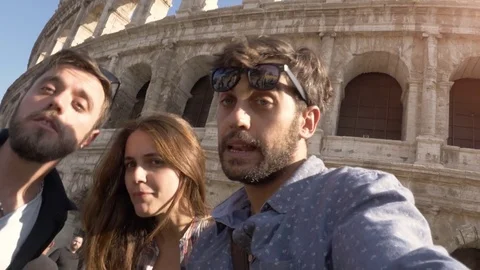CAMERA POV Three happy young friends tourists with bikes and backpacks at Stock Footage 84938240