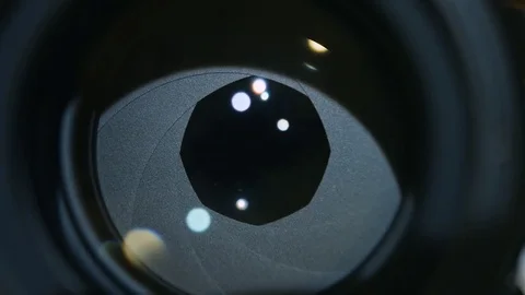 Camera prime lens. Close Up of closing camera aperture Stock Footage 84037315