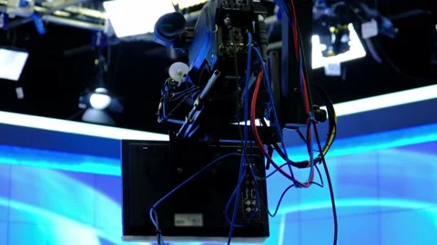 A camera with a prompter on it is moving over the crane arm. (Camera jib) Stock Footage 148676802