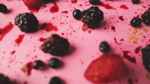 Camera pull back in a table of berries in a pink background Stock Footage 140041901
