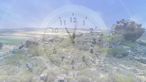 Camera pulling back and panning right, clock hands moving, revealing ridge and Video stock 331161064