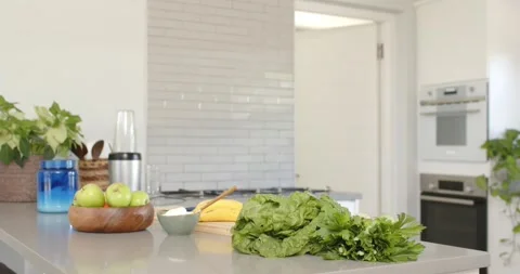 Camera is pulling back and panning left, revealing leafy greens on island Stock Footage 335479584