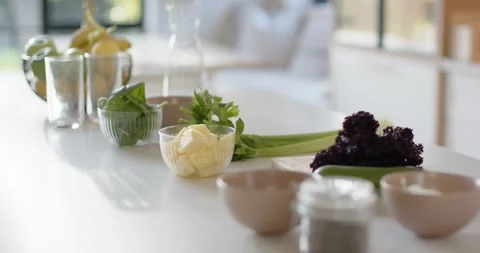 Camera is pulling back and shifting focus to reveal countertop ingredients and Stock Footage 345589723