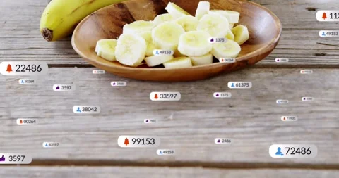 Camera pulling back, animated badges clustering around sliced banana bowl, Stock Footage 331634771