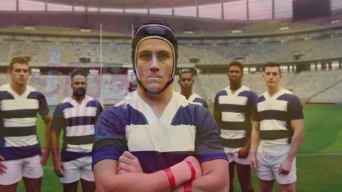 Camera pulling back central rugby captain standing arms crossed, wearing scrum Stock Footage 329870676
