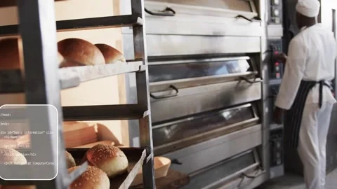 Camera pulling back, code overlays showing over oven, bakery rack, baker tuning Stock Footage 333318027