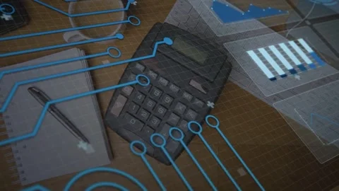 Camera pulling back, desk calculator receiving blue traces and data panels Stock Footage 335212067