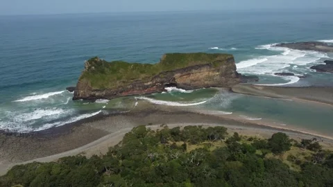 Camera pulling back from Hole in the Wall natural arch geological landmark, with Stock Footage 316895725