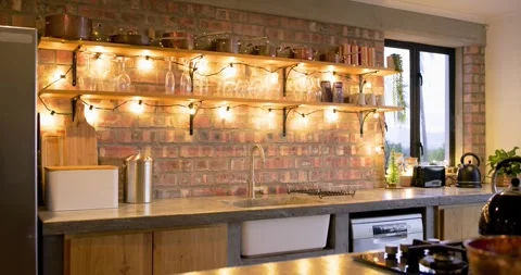 Camera is pulling back, panning revealing countertop, kettle, shelves showcasing Stock Footage 319779345