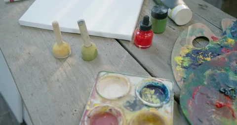 Camera is pulling back, revealing white canvas sliding center-right as workspace Stock Footage 341938675