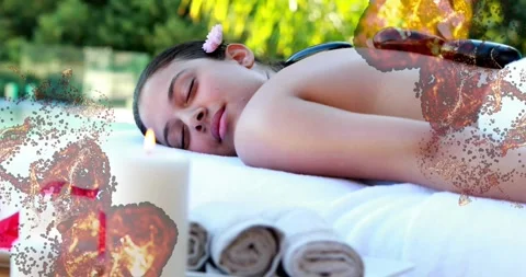 Camera pulling back revealing woman waiting for massage on spa table while Stock Footage 329518263