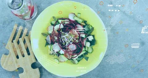 Camera pulling back, revealing yellow salad bowl on tabletop, overlays tagging Stock Photos