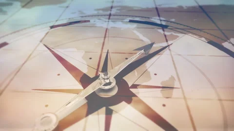 Camera pulling back showing 3D compass dial and metallic arrow turning clockwise Stock Footage 312897923