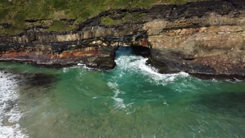 Camera pulling back from very close Hole in the Wall natural arch geological Stock Footage 316896252