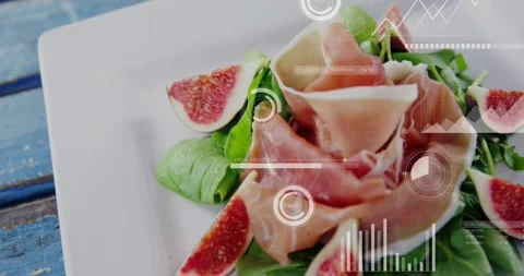 Camera pulling back while HUD graphs sliding in, annotating plated salad figs 库存影片 334033638