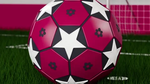 Camera pulling, tracking maroon soccer ball rotating toward goal, settling on Stock Footage 333286151