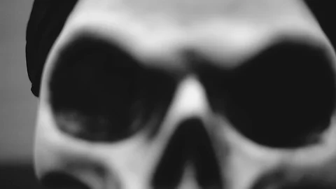 Camera Pulls Back from a Creepy Halloween Skulls Eye Socket Stock Footage 116451415
