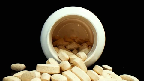Camera pulls out of a bottle of vitamins Stock-Footage 195144537