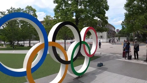 Camera push into Olympic Rings Symbol in front of Olympic Stadium Stock Footage 156379512