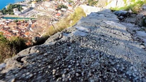 The camera quickly moves down over the brick parapet that encloses and secures Stock Footage 172273119