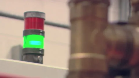 Camera Rack Focus Between Pipe and Flashing Light Stock Footage 40619696