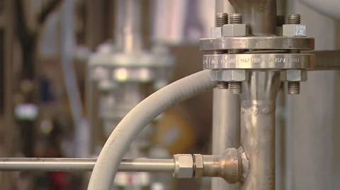 Camera Rack Focus Between Pipes In Factory Stock Footage 40618729