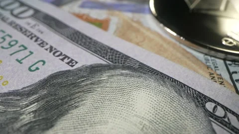 Camera raise to many US banknotes which rotate on the table. Hundred of dollars Video stock 177093046