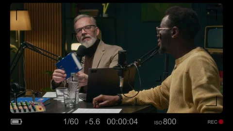 Camera Recording View of Writer Communicating with Host during Radio Interview Stock Footage 309318334