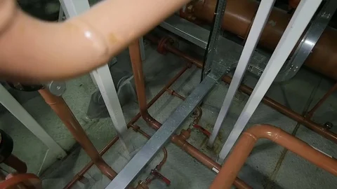 Camera Removes from Pipe Constructions in Oil Enterprise Stock Footage