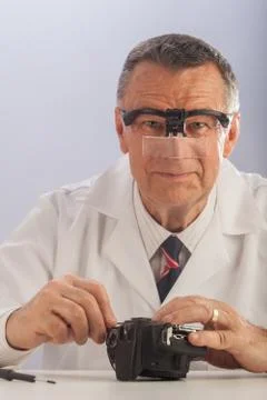 Camera repairman Stock Photos
