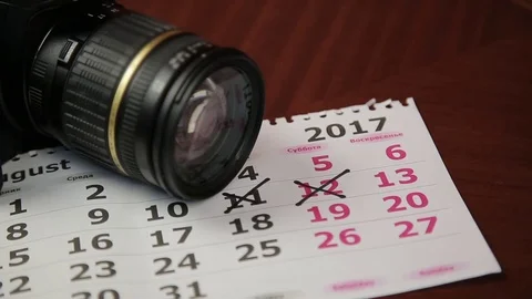 The camera rests on the calendar Stock Footage