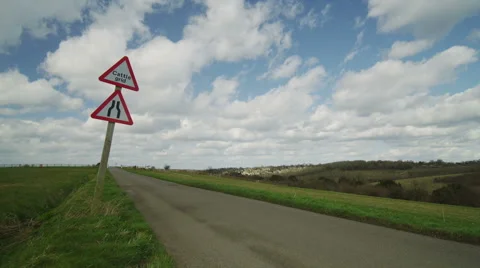 Camera reveal from clouds in the sky to country road Stock Footage 48705587