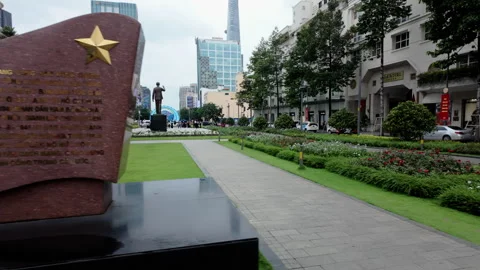 Camera reveals Ho Chi Minh statue near Rex Hotel in Saigon. Stock Footage 307832025