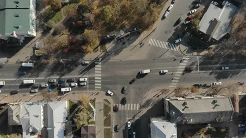 The camera rises above the busy intersection. Time lapse. Stock Footage 100996572
