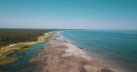 The camera rises above sandy coastline Stock Footage 146702023