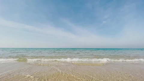 The camera rises above the sea waves on a bright sunny day Stock Footage 146480331