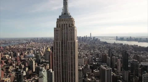 Camera rises along Empire State Building toward Lower Manhattan 스톡 동영상 62817048
