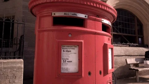 Camera rises from behind traditional British postbox in Oxford Stock Footage 97430949