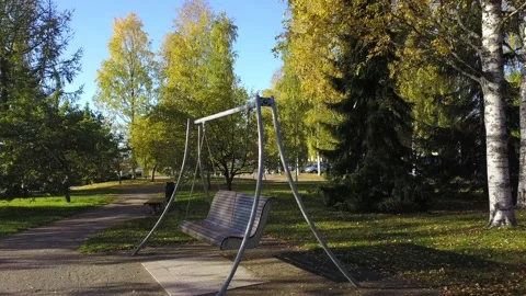 The camera rises from the ground above the city park in Joensuu, Finland. Stock Footage 130589206