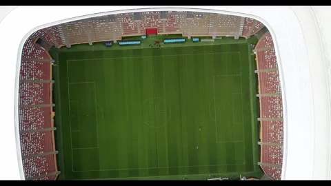 The camera rises high above the field of an empty stadium Stock Footage 270484271