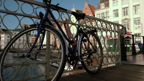 Camera rises jib style from behind bicycle on Grasbrug Stock Footage 90072745