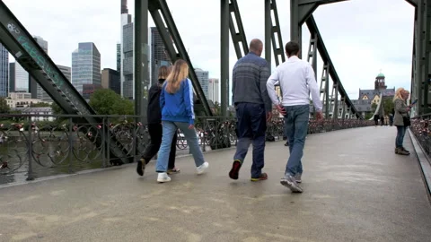 Camera rises jib style on Iron Footbridge in Frankfurt Stock Footage 260315814