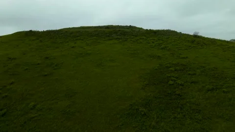 The camera rises near the mountains and the seascape opens Stock Footage 162638015