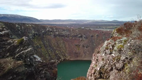 Camera rises up over Kerid crater in Iceland Video stock 308816054