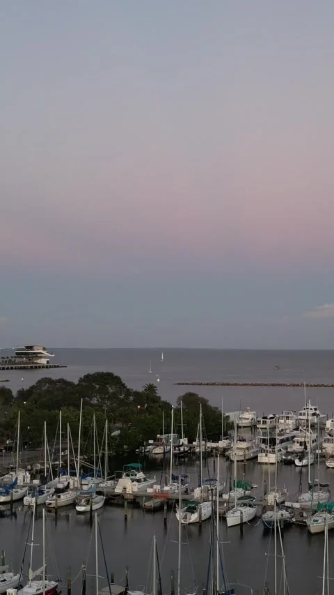 Camera rises over a marina at dusk Stock Footage 337120455