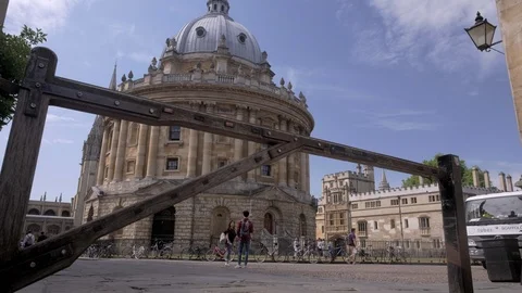 Camera rises past gate on Catte Street to reveal Radcliffe Camera Stock Footage 95224813