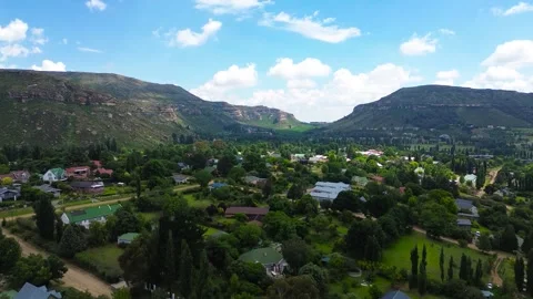 Camera rising up close-up view of the town centre of Clarens South Africa wi Stock Footage 324229488