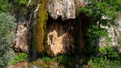 The camera rising up over the hill and waterfall. 스톡 동영상 113726342