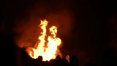 Camera roll of bonfire on November 5th through a crowd Video stock 234060800